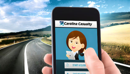 User holding a smartphone with the Carolina Casualty Claims app displayed on it